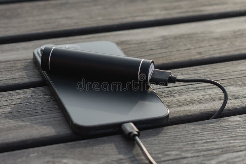 portable power bank and charging station on wooden table